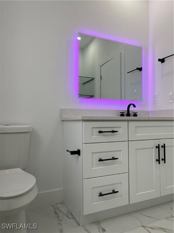 707 NE Juanita Place, Cape Coral, FL 33909 - bathroom with marble look tiles and vanity