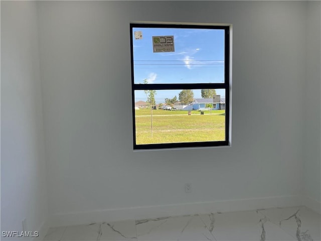 707 NE Juanita Place, Cape Coral, FL 33909 - spare room with marble look tile flooring