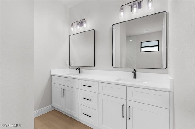 1299 Argosy Rd, Labelle, FL 33935 - full bathroom with double vanity and wood finished floors