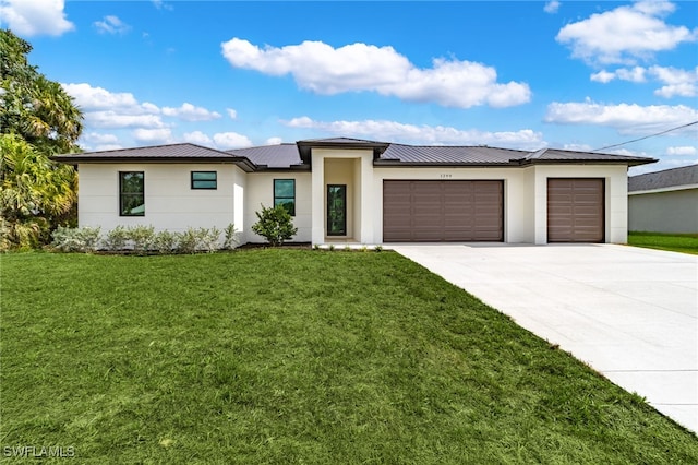 1299 Argosy Rd, Labelle, FL 33935 - prairie-style home featuring an attached garage, driveway, a front yard, and a metal roof