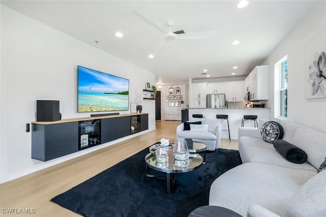 10490 Spruce Pine Ct, Fort Myers, FL 33913 - living area featuring light wood finished floors, ceiling fan, and recessed lighting