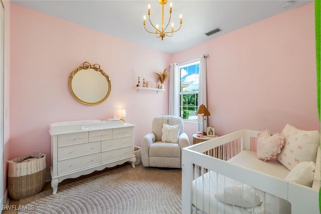 10490 Spruce Pine Ct, Fort Myers, FL 33913 - carpeted bedroom featuring a chandelier and a crib
