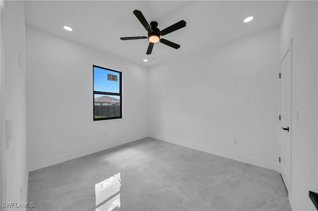 2018 Nelson Rd N, Cape Coral, FL 33993 - empty room with light marble finish floors, recessed lighting, and a ceiling fan