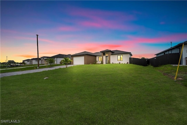 2018 Nelson Rd N, Cape Coral, FL 33993 - view of front of house with driveway, a garage, and stucco siding