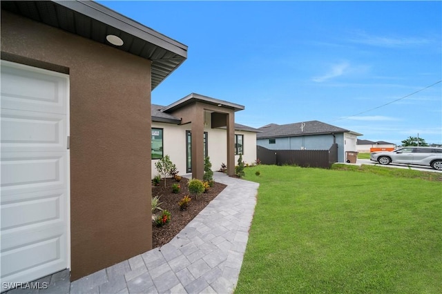 2018 Nelson Rd N, Cape Coral, FL 33993 - view of yard with a garage