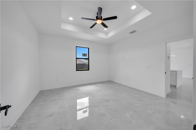2018 Nelson Rd N, Cape Coral, FL 33993 - empty room featuring recessed lighting, light marble finish floors, a ceiling fan, and a raised ceiling