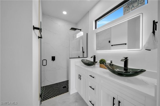 2018 Nelson Rd N, Cape Coral, FL 33993 - bathroom with a marble finish shower, marble look tiles, double vanity, and recessed lighting