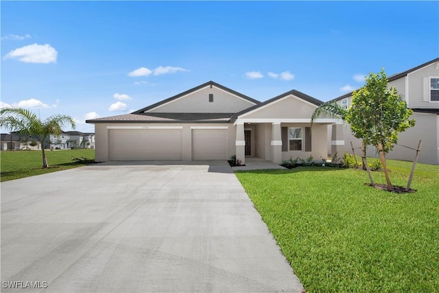 17620 Monte Isola Way N, Fort Myers, FL 33917 - single story home with concrete driveway, stucco siding, a garage, and a front lawn