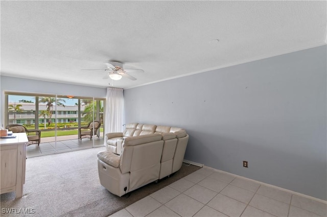 418 12th Ave S Unit C418, Naples, FL 34102 - living room featuring a ceiling fan, a textured ceiling, and ornamental molding