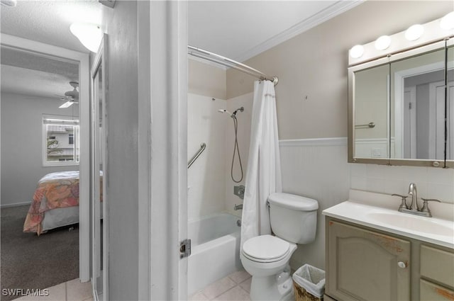 418 12th Ave S Unit C418, Naples, FL 34102 - ensuite bathroom with shower / bath combo with shower curtain, vanity, a ceiling fan, a wainscoted wall, and ornamental molding