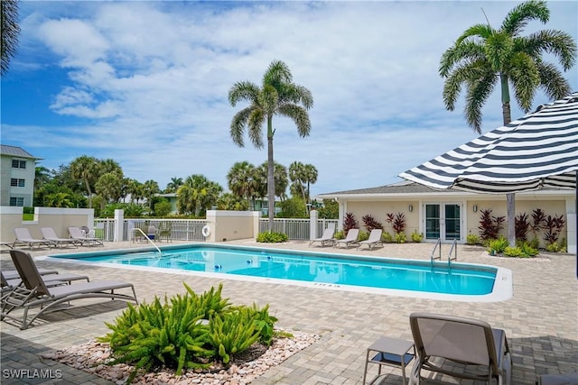 418 12th Ave S Unit C418, Naples, FL 34102 - community pool featuring french doors and a patio area