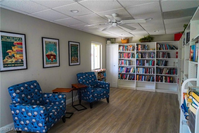 418 12th Ave S Unit C418, Naples, FL 34102 - sitting room with wood finished floors, a paneled ceiling, and ceiling fan