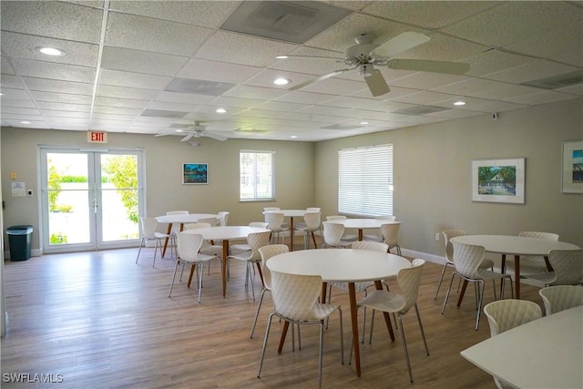 418 12th Ave S Unit C418, Naples, FL 34102 - dining space featuring a ceiling fan, wood finished floors, and a paneled ceiling