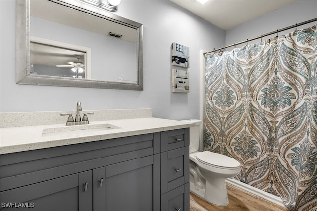 343 Golden Gate Blvd E, Naples, FL 34120 - full bath featuring vanity, wood finished floors, a shower with shower curtain, and ceiling fan