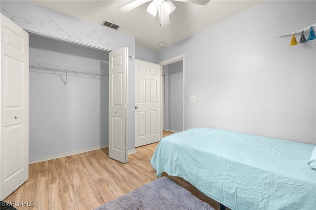 343 Golden Gate Blvd E, Naples, FL 34120 - bedroom with light wood finished floors, a ceiling fan, and a closet