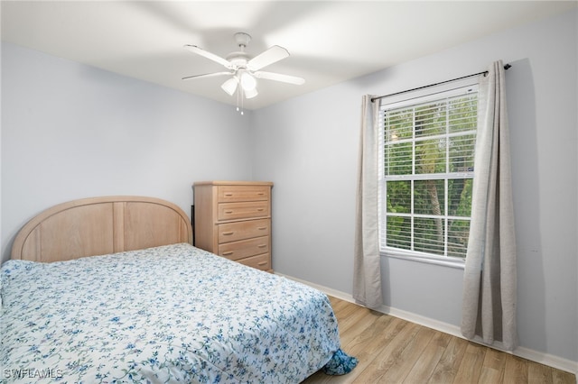 343 Golden Gate Blvd E, Naples, FL 34120 - bedroom with light wood-style floors and a ceiling fan