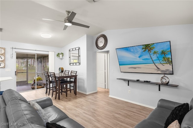 343 Golden Gate Blvd E, Naples, FL 34120 - living area featuring vaulted ceiling, ceiling fan, and wood finished floors