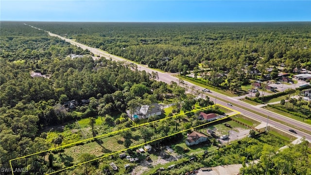 343 Golden Gate Blvd E, Naples, FL 34120 - aerial view of property and surrounding area featuring a heavily wooded area and property boundaries highlighted