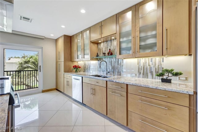 7105 Quail Run Ct W Unit 4, Fort Myers, FL 33908 - kitchen featuring dishwasher, light stone countertops, light tile patterned floors, glass insert cabinets, and recessed lighting