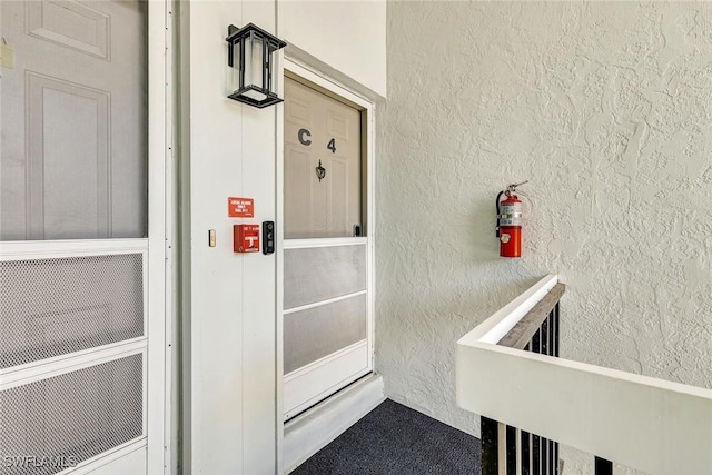 7105 Quail Run Ct W Unit 4, Fort Myers, FL 33908 - doorway to property featuring stucco siding