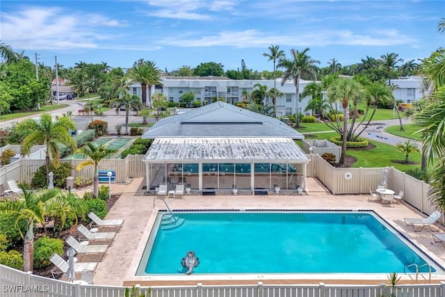 7105 Quail Run Ct W Unit 4, Fort Myers, FL 33908 - community pool featuring a patio and a fenced backyard