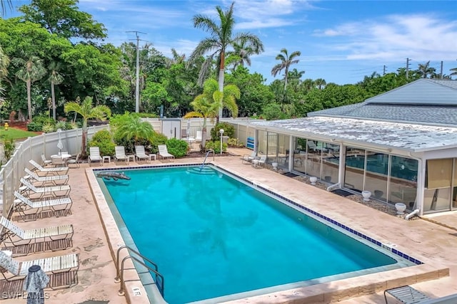 7105 Quail Run Ct W Unit 4, Fort Myers, FL 33908 - community pool with a patio area and view of scattered trees