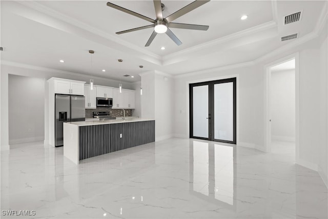 4371 47th Ave NE, Naples, FL 34120 - kitchen with stainless steel appliances, french doors, crown molding, a ceiling fan, and white cabinets