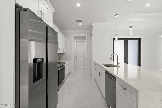 4371 47th Ave NE, Naples, FL 34120 - kitchen with appliances with stainless steel finishes, ornamental molding, light marble finish flooring, white cabinetry, and light stone counters