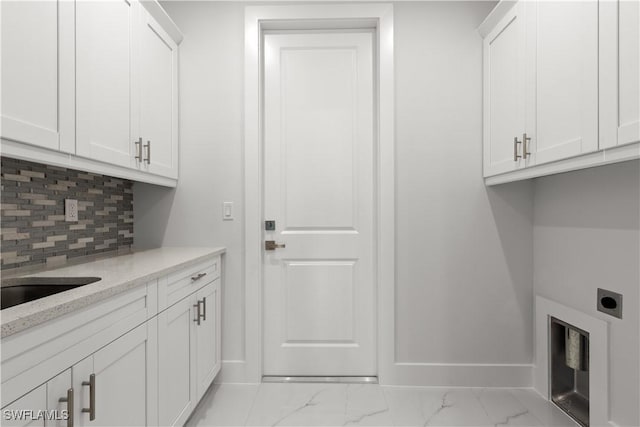 4371 47th Ave NE, Naples, FL 34120 - laundry room with hookup for an electric dryer, light marble finish flooring, and cabinet space