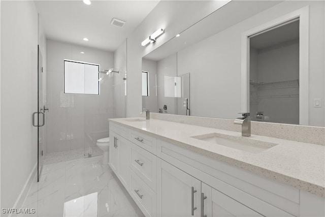 4371 47th Ave NE, Naples, FL 34120 - full bathroom featuring double vanity, marble finish floors, a stall shower, a walk in closet, and recessed lighting