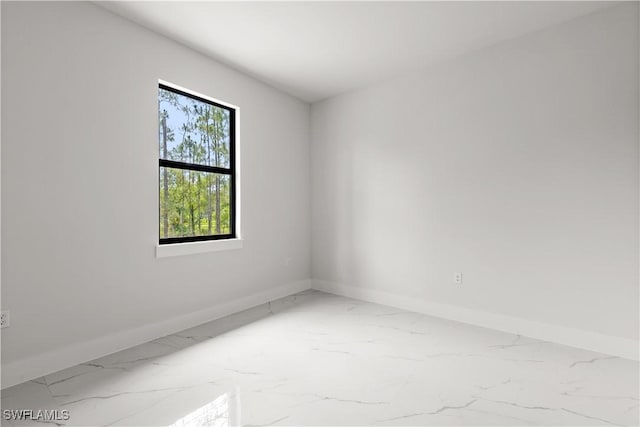 4371 47th Ave NE, Naples, FL 34120 - spare room with marble finish floors and baseboards