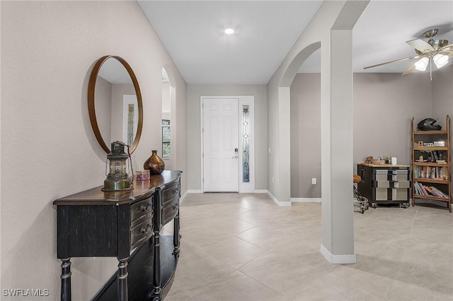 14659 Adina Ln, Fort Myers, FL 33905 - foyer featuring arched walkways, a ceiling fan, and light tile patterned floors