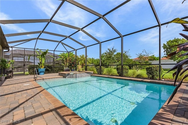 14659 Adina Ln, Fort Myers, FL 33905 - view of pool featuring a pool with connected hot tub, a patio area, and glass enclosure