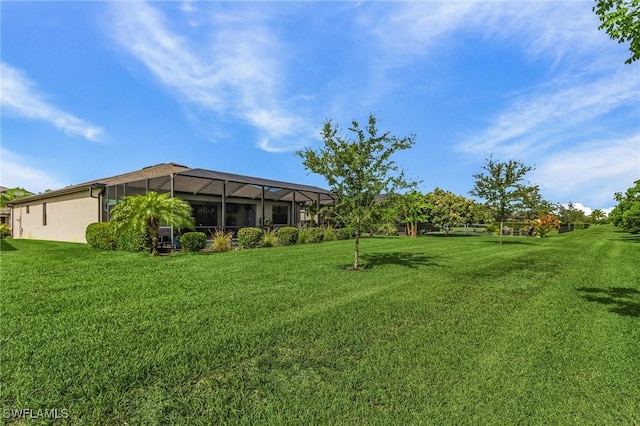 14659 Adina Ln, Fort Myers, FL 33905 - view of green lawn with a lanai