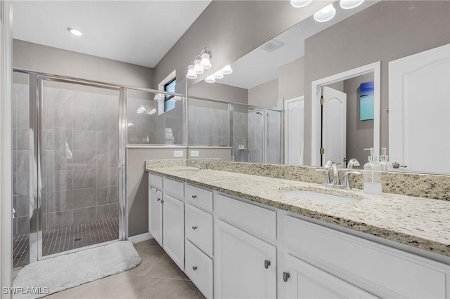 14659 Adina Ln, Fort Myers, FL 33905 - full bathroom featuring double vanity, a shower stall, and tile patterned floors