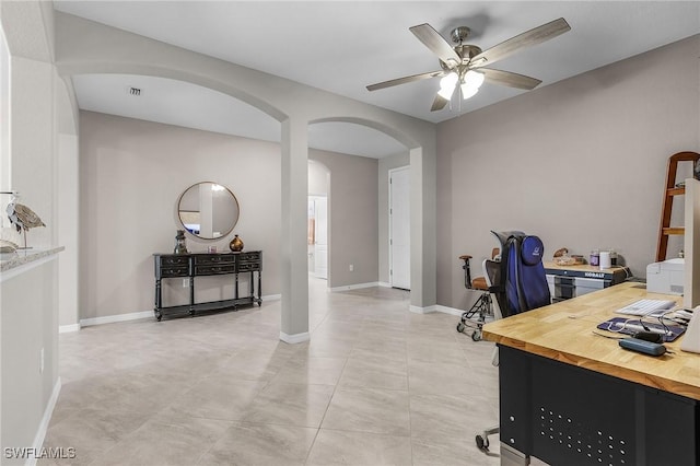 14659 Adina Ln, Fort Myers, FL 33905 - office area featuring arched walkways, ceiling fan, and light tile patterned floors