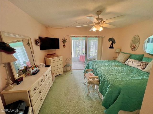 331 Joel Blvd Unit 109, Lehigh Acres, FL 33936 - bedroom with access to exterior, light carpet, and ceiling fan