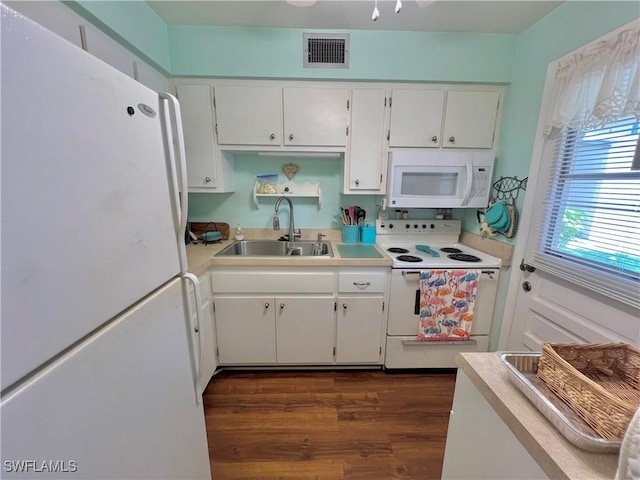 331 Joel Blvd Unit 109, Lehigh Acres, FL 33936 - kitchen featuring white appliances, white cabinets, dark wood-style floors, and light countertops