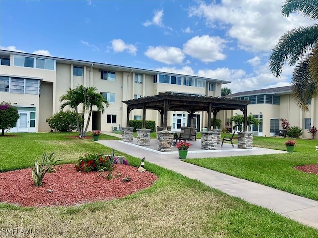 331 Joel Blvd Unit 109, Lehigh Acres, FL 33936 - back of property featuring stucco siding, a pergola, a yard, and a patio