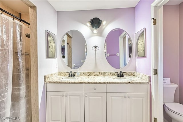 914 SW 9th Ct, Cape Coral, FL 33991 - bathroom featuring double vanity and a shower with shower curtain