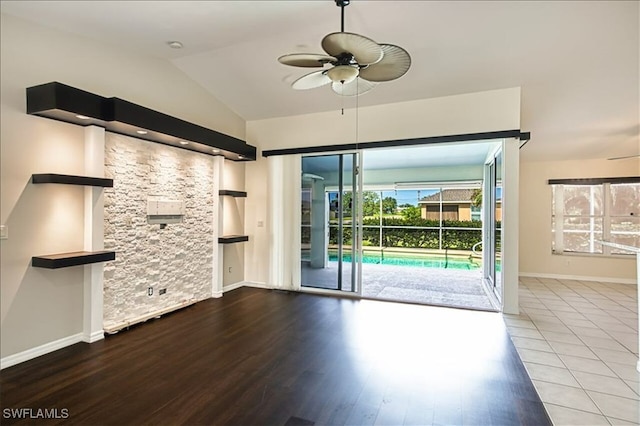 914 SW 9th Ct, Cape Coral, FL 33991 - unfurnished living room with ceiling fan, wood finished floors, and lofted ceiling