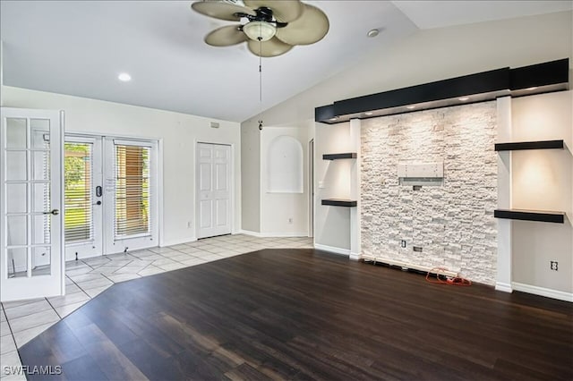 914 SW 9th Ct, Cape Coral, FL 33991 - unfurnished living room with vaulted ceiling, french doors, ceiling fan, and wood finished floors
