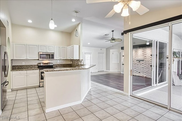 914 SW 9th Ct, Cape Coral, FL 33991 - kitchen with appliances with stainless steel finishes, a ceiling fan, light tile patterned floors, white cabinetry, and high vaulted ceiling