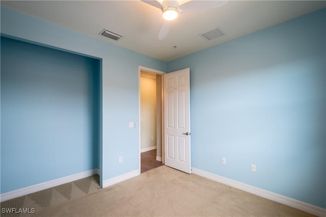 6533 Monterey Pt Unit 204, Naples, FL 34105 - unfurnished bedroom featuring light colored carpet and a ceiling fan