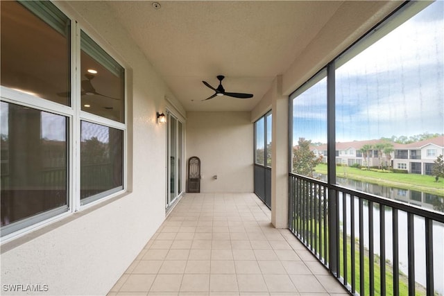 6533 Monterey Pt Unit 204, Naples, FL 34105 - balcony featuring a water view, ceiling fan, and a residential view