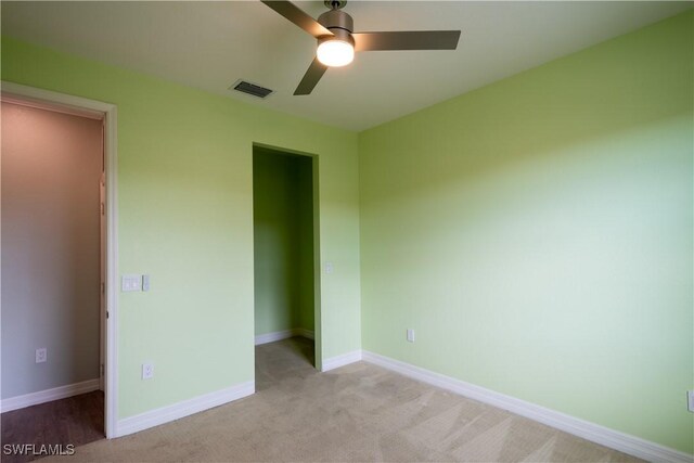 6533 Monterey Pt Unit 204, Naples, FL 34105 - unfurnished bedroom featuring light carpet and a ceiling fan