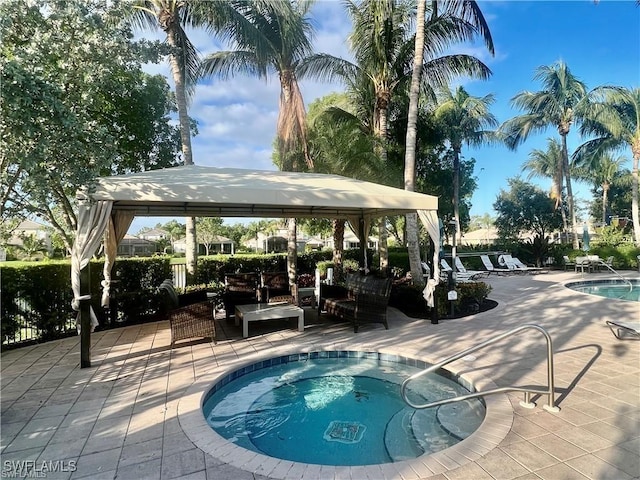6533 Monterey Pt Unit 204, Naples, FL 34105 - community pool featuring a gazebo, a patio area, and an outdoor hangout area
