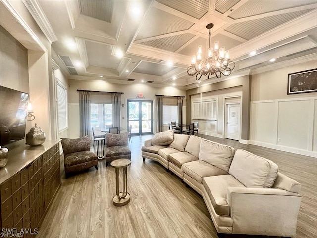 6533 Monterey Pt Unit 204, Naples, FL 34105 - living area with a decorative wall, coffered ceiling, wood finished floors, a chandelier, and ornamental molding