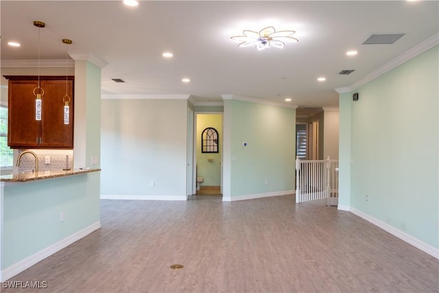 6533 Monterey Pt Unit 204, Naples, FL 34105 - unfurnished living room featuring recessed lighting, light wood-style flooring, and ornamental molding