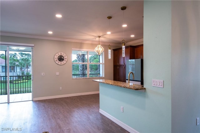 6533 Monterey Pt Unit 204, Naples, FL 34105 - kitchen with freestanding refrigerator, a chandelier, stone counters, recessed lighting, and ornamental molding